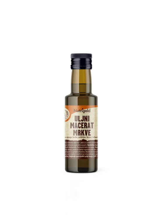 Nutrigold organic carrot macerated oil in a dark glass bottle of 100ml