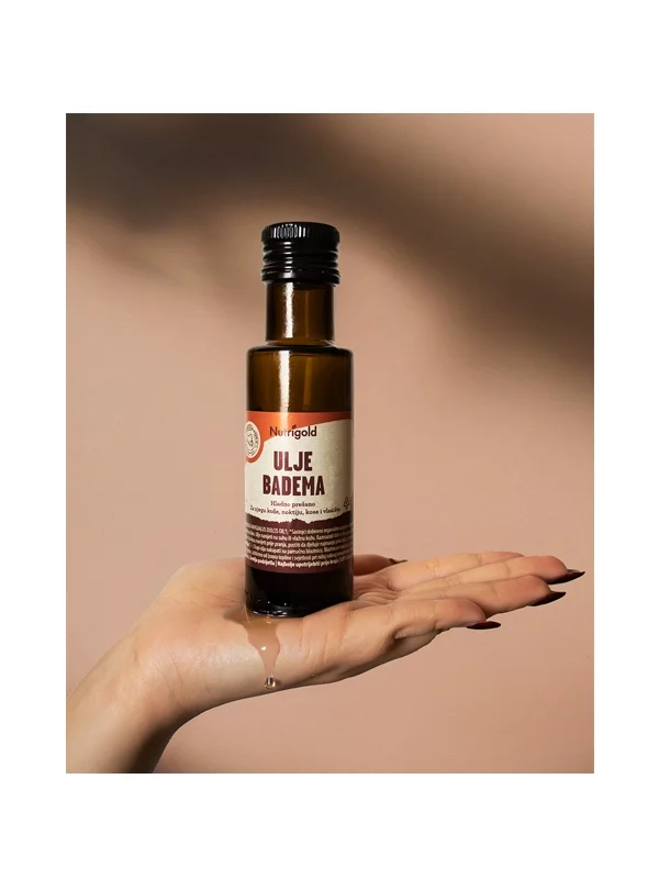 Nutrigold organic cold pressed almon oil in a dark glass bottle of 100ml