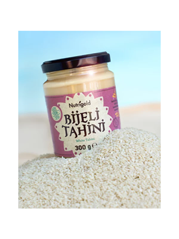 Nutrigold white tahini paste in a glass jar of 300g